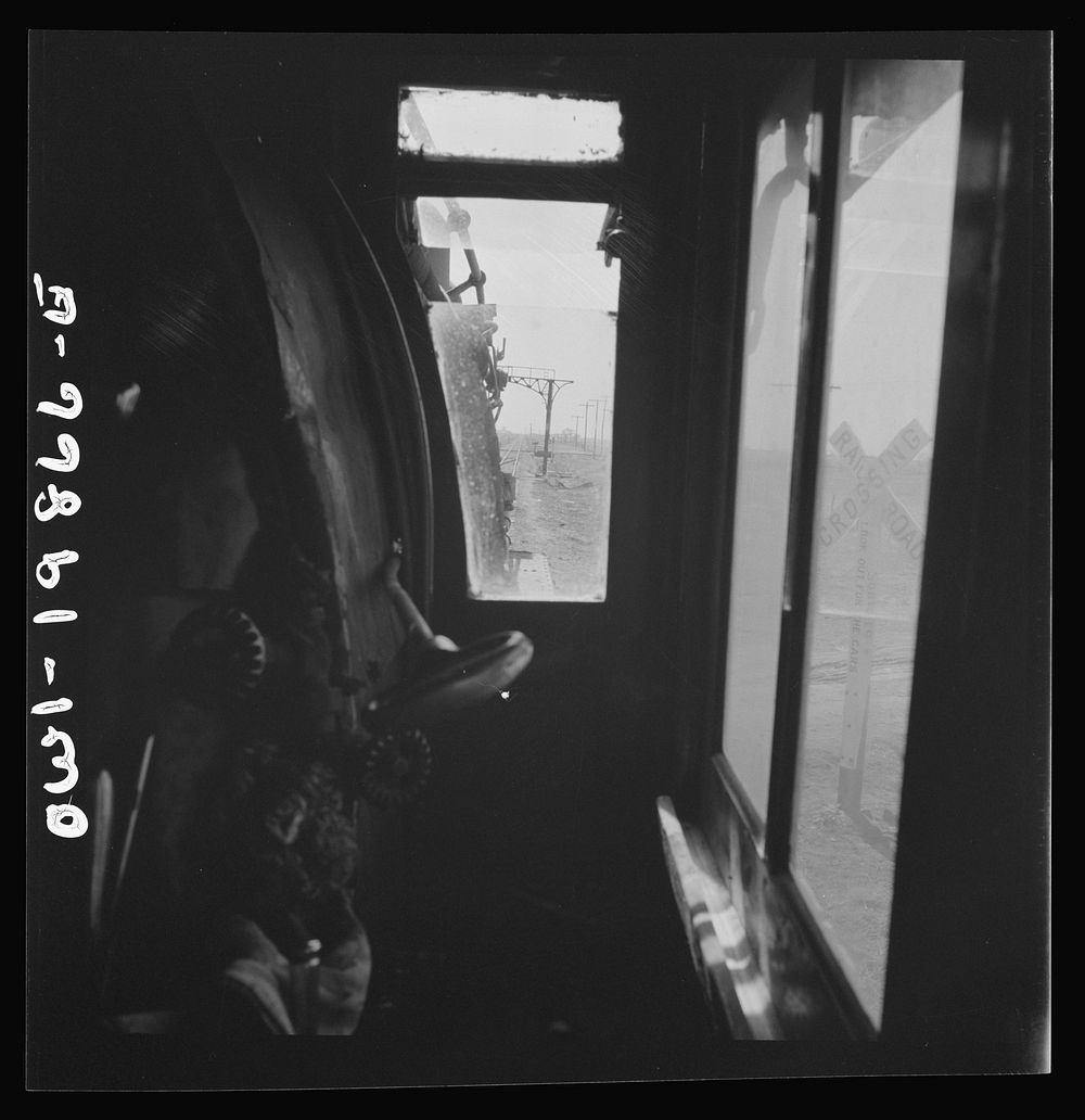 Kiowa, Kansas. The engineer's window in the cab of a locomotive. Waiting for block signal to change on the Atchison, Topeka…