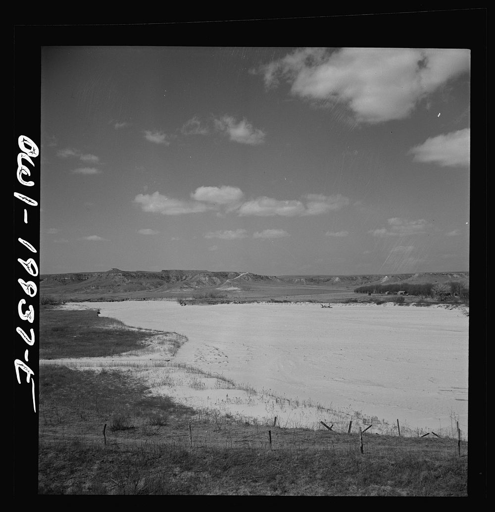 A dry riverbed in the "breaks" country of the northeast Texas Panhandle along the Atchison, Topeka and Santa Fe Railroad…