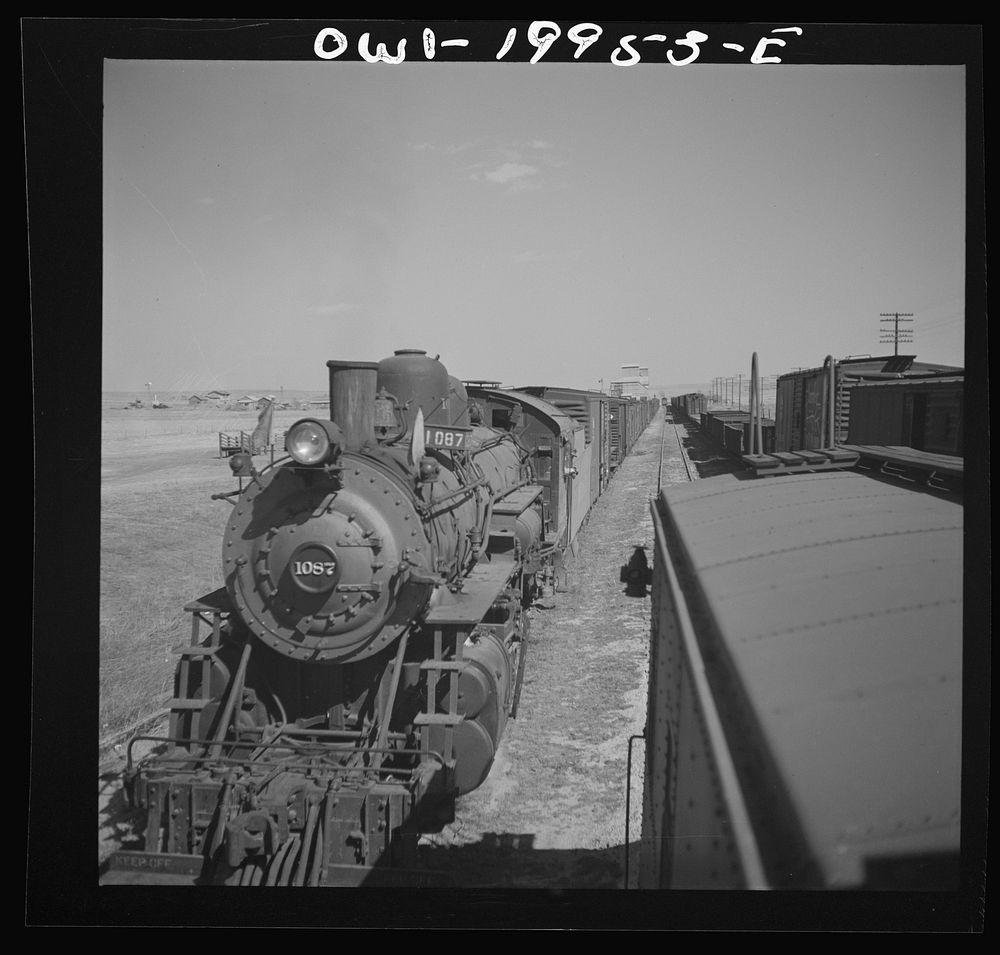 [Untitled photo, possibly related to: Kiowa, Kansas. Freight train pulling out on the Atchison, Topeka and Santa Fe Railroad…