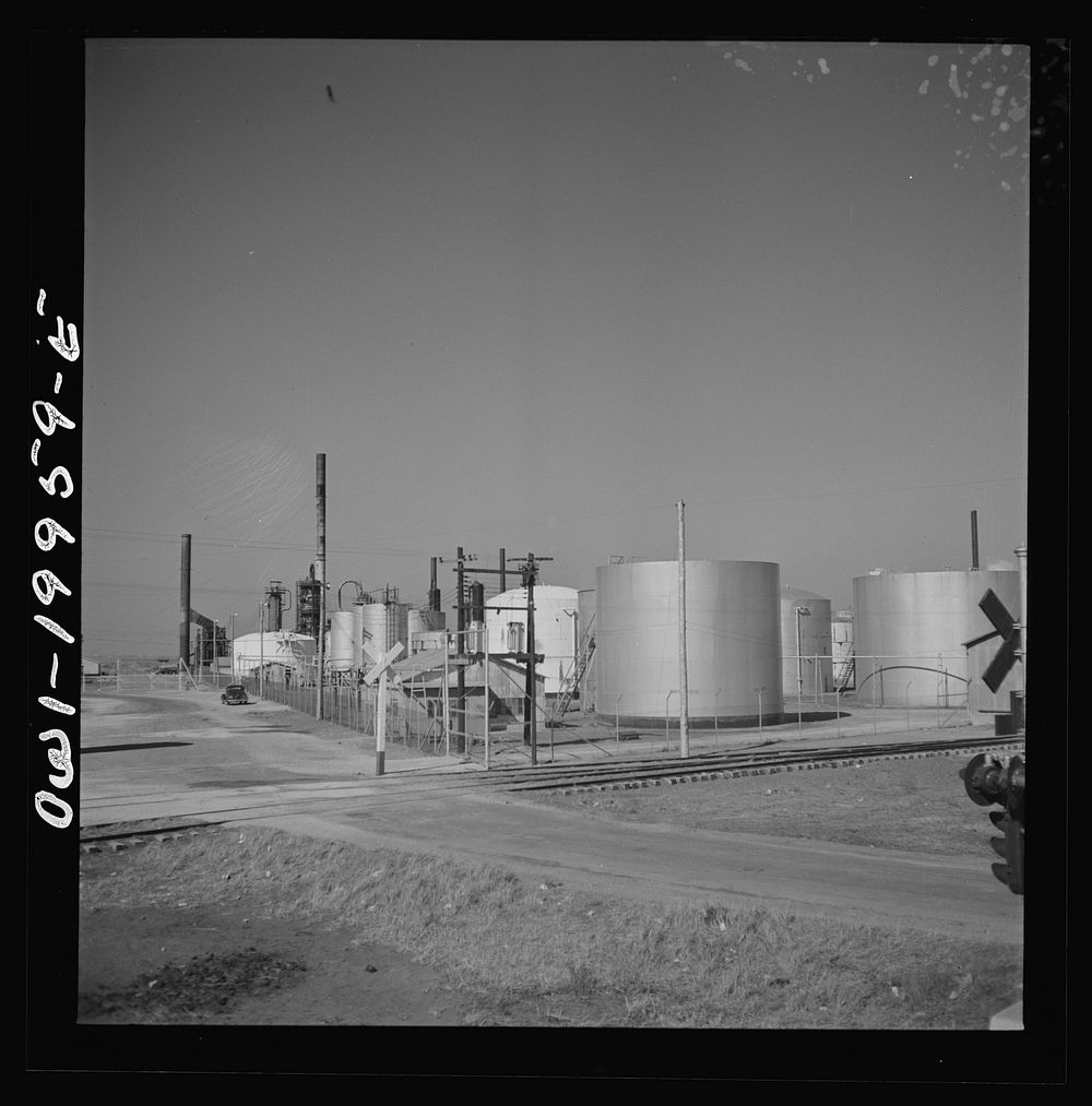 Pampa, Texas. Passing an oil refinery along the Atchison, Topeka, and Santa Fe Railroad. Sourced from the Library of…