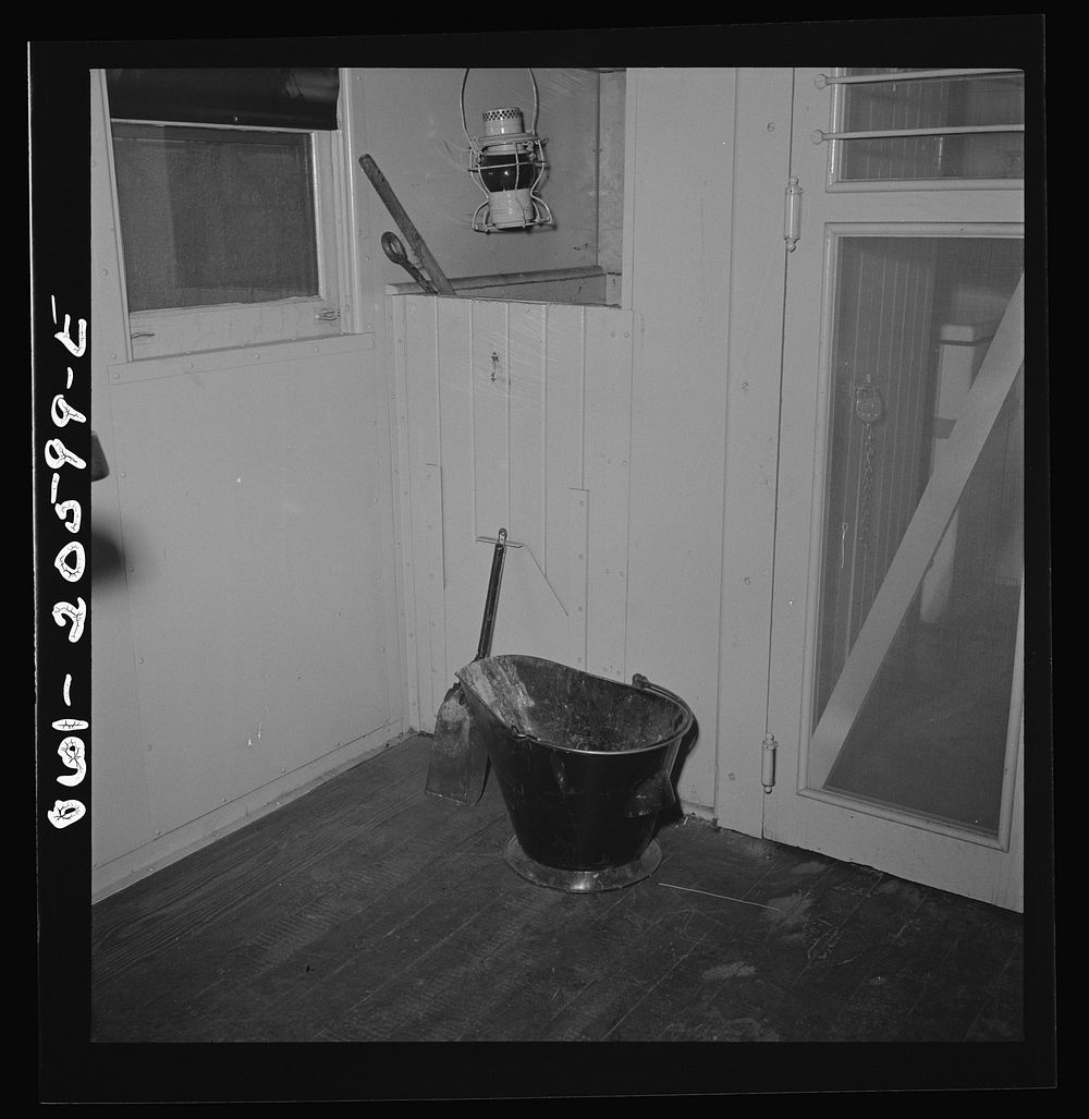 Clovis, New Mexico. Coal bucket and bin of a new caboose on the Atchison, Topeka and Santa Fe Railroad. Sourced from the…