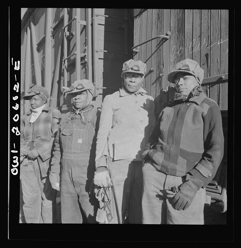 Clovis, New Mexico. Women employed at the Atchison, Topeka and Santa Fe Railroad yard to clean out the potash jars. Left to…