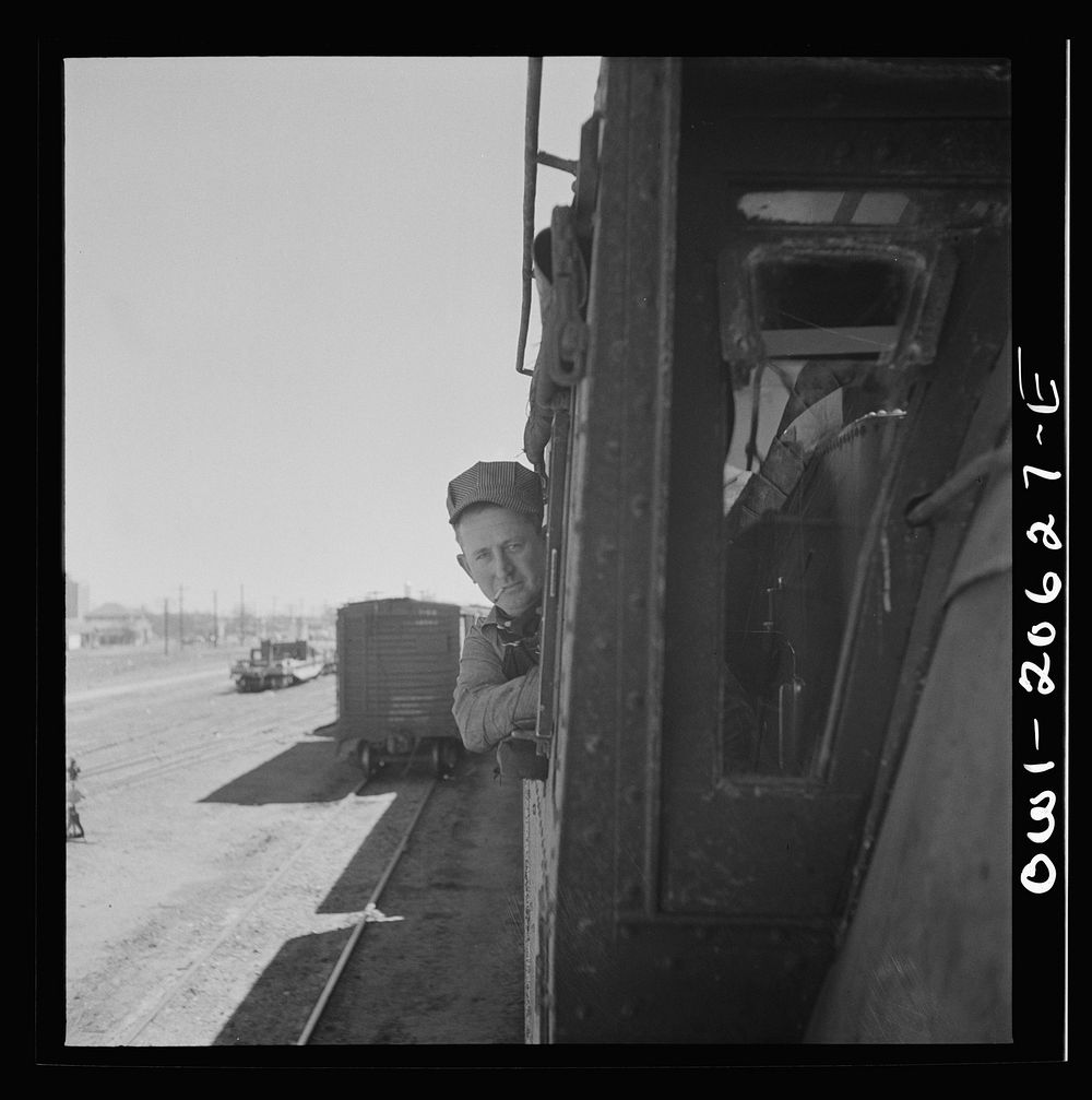 Clovis, New Mexico. D.L. Clark, engineer, ready to start his locomotive out of the Atchison, Topeka and Santa Fe Railroad…