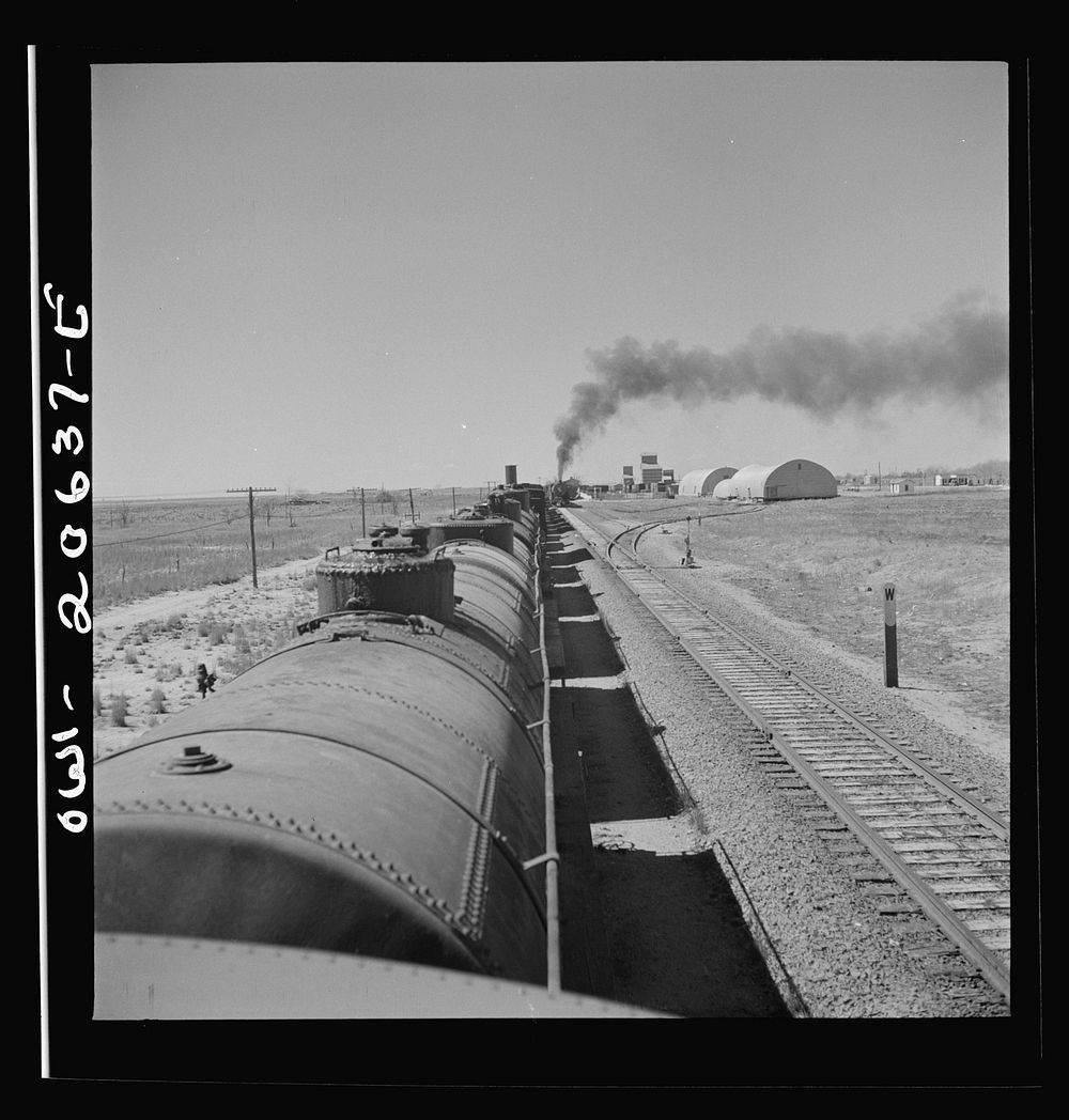 Melrose, New Mexico. Train stopping for water along the Atchison, Topeka, and Santa Fe Railroad. Sourced from the Library of…