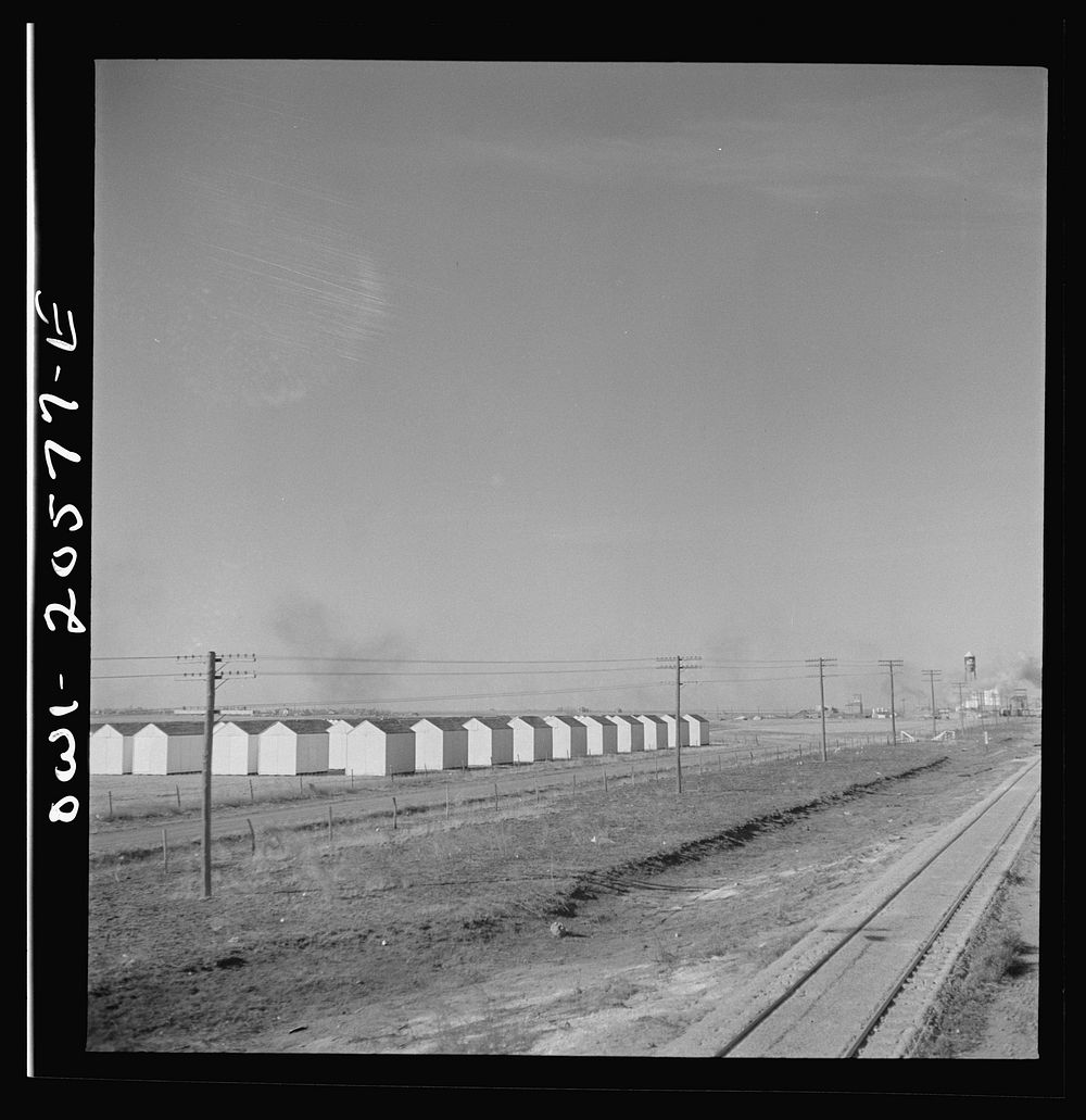 [Untitled photo, possibly related to: Hereford, Texas. Grain storage bins on the Atchison, Topeka, and Santa Fe Railroad…