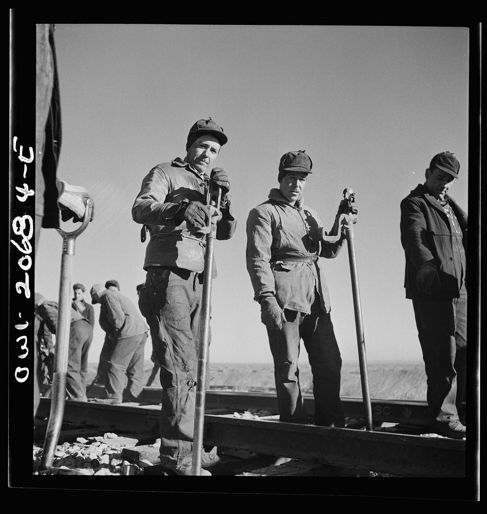 Iden, New Mexico. Jacob Chaves of Torion, New Mexico, left, and Louis Bocca of Willard, New Mexico. Section workers on a job…