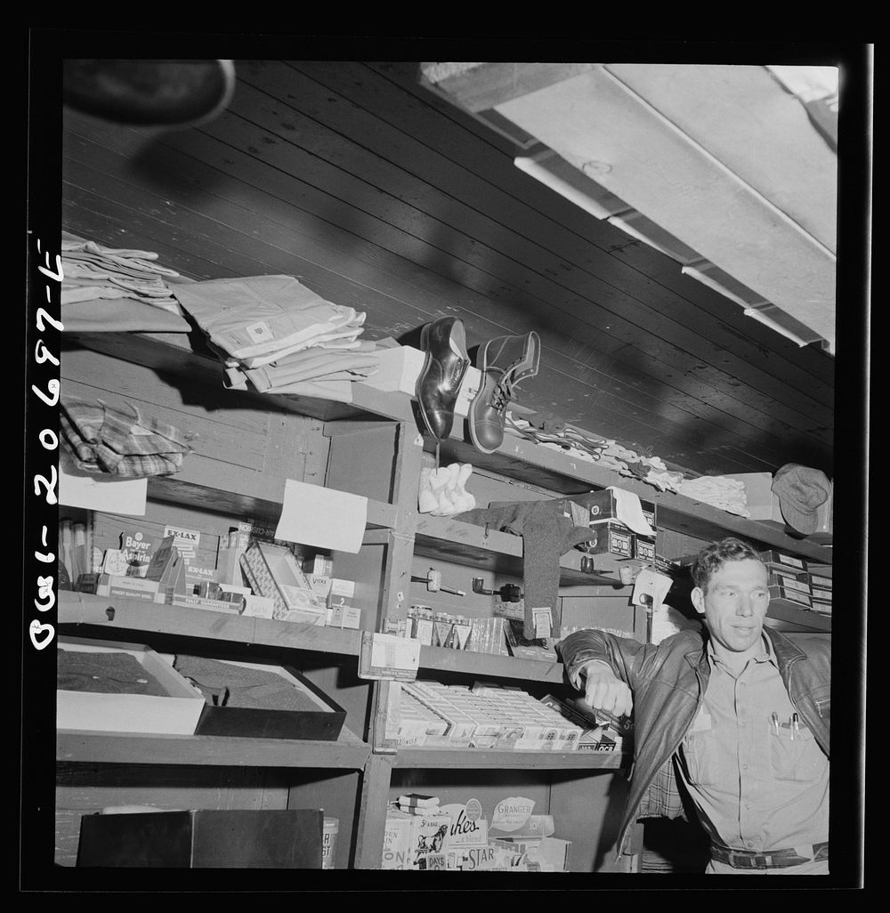 Iden, New Mexico. In the commissary car of a work train on the Atchison, Topeka and Santa Fe Railroads. The clerk is J.E.…