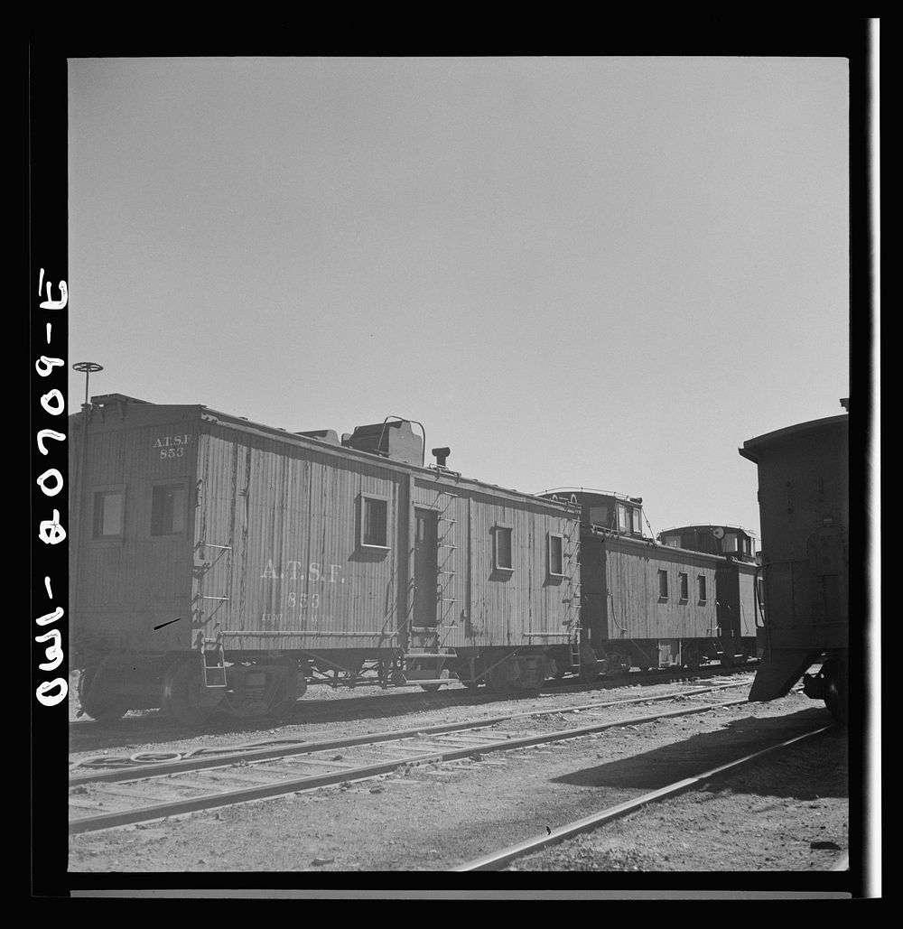 [Untitled photo, possibly related to: Vaughn, New Mexico. A caboose on the Atchison, Topeka and Santa Fe Railroad yard…
