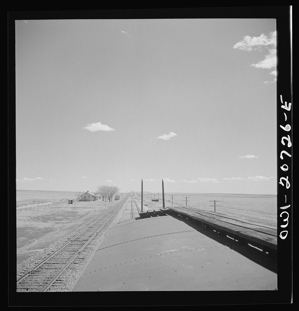 Encino, New Mexico. Passing a section house along the Atchison, Topeka and Santa Fe Railroad between Vaughn and Belen, New…