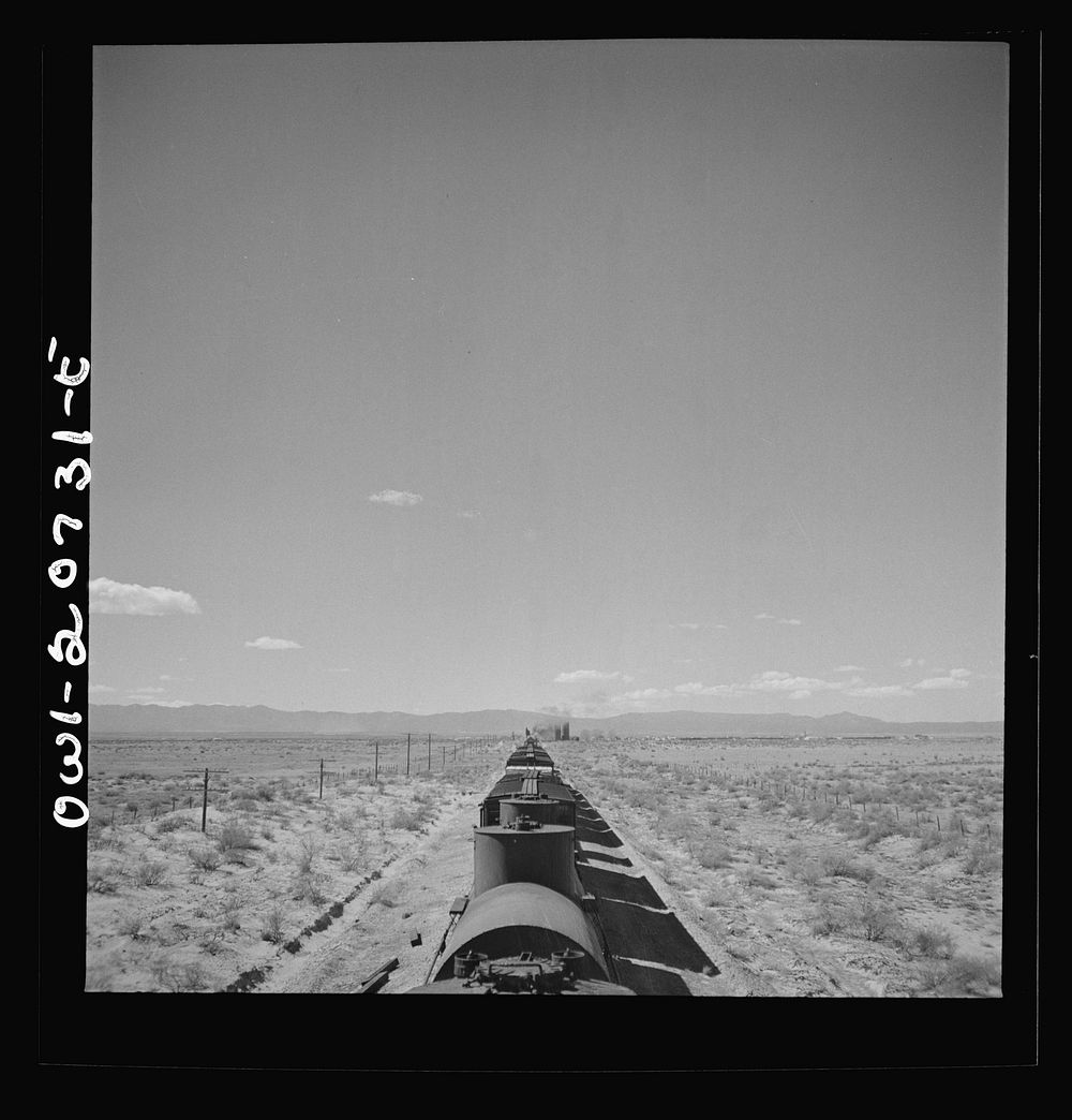Willard, New Mexico. Stopping for water along the Atchison, Topeka and Santa Fe Railroad between Vaughn and Belen, New…