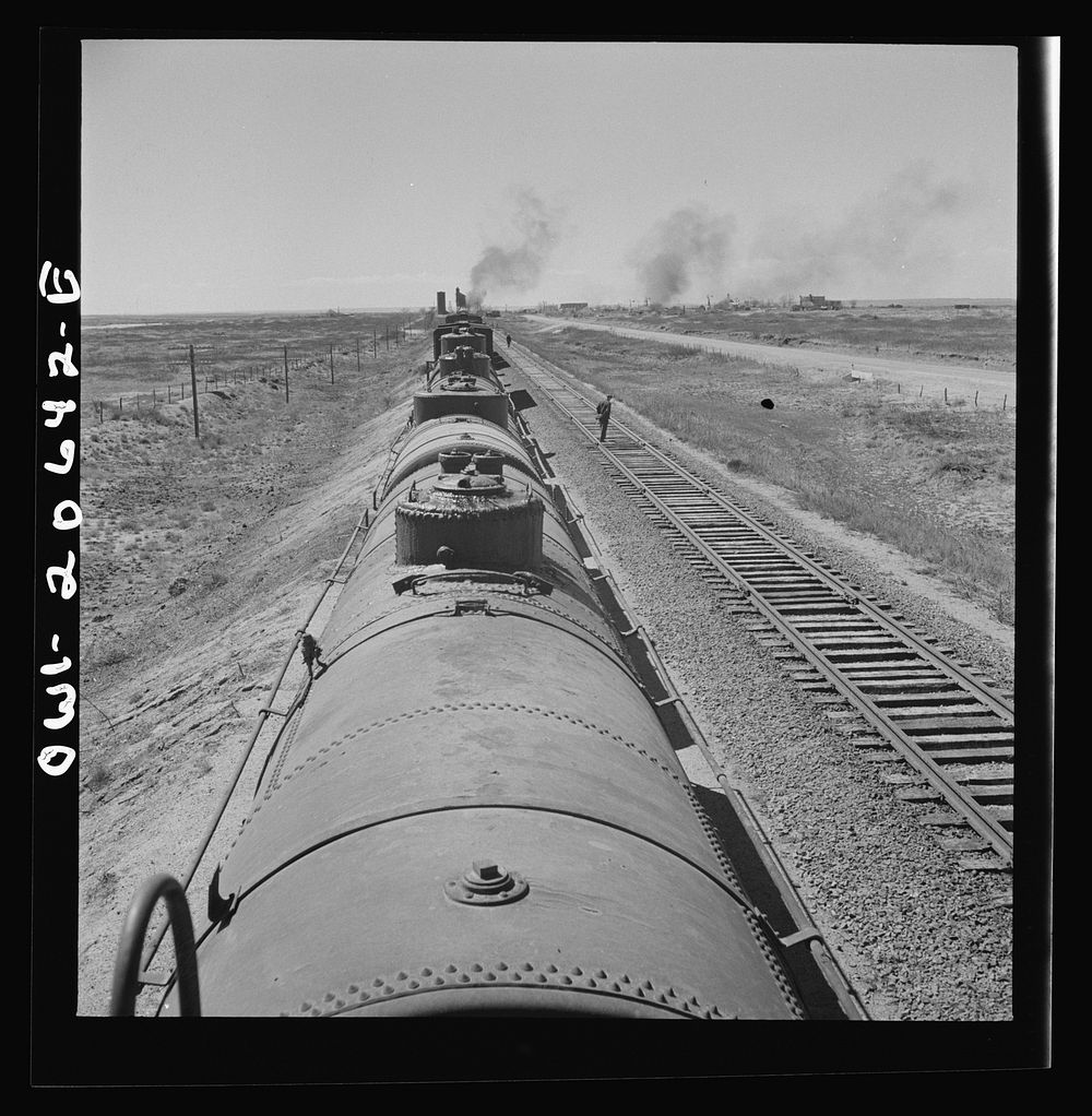 [Untitled photo, possibly related to: Tolar, New Mexico. Atchison, Topeka, and Santa Fe Railroad train between Clovis and…