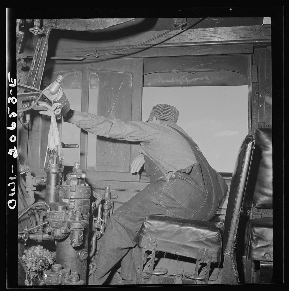 Ricardo, New Mexico. Engineer in his cab about to start the train along the Atchison, Topeka, and Santa Fe Railroad between…