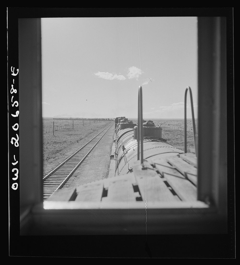 [Untitled photo, possibly related to: Yeso, New Mexico. Rounding a curve along the Atchison, Topeka, and Santa Fe Railroad…