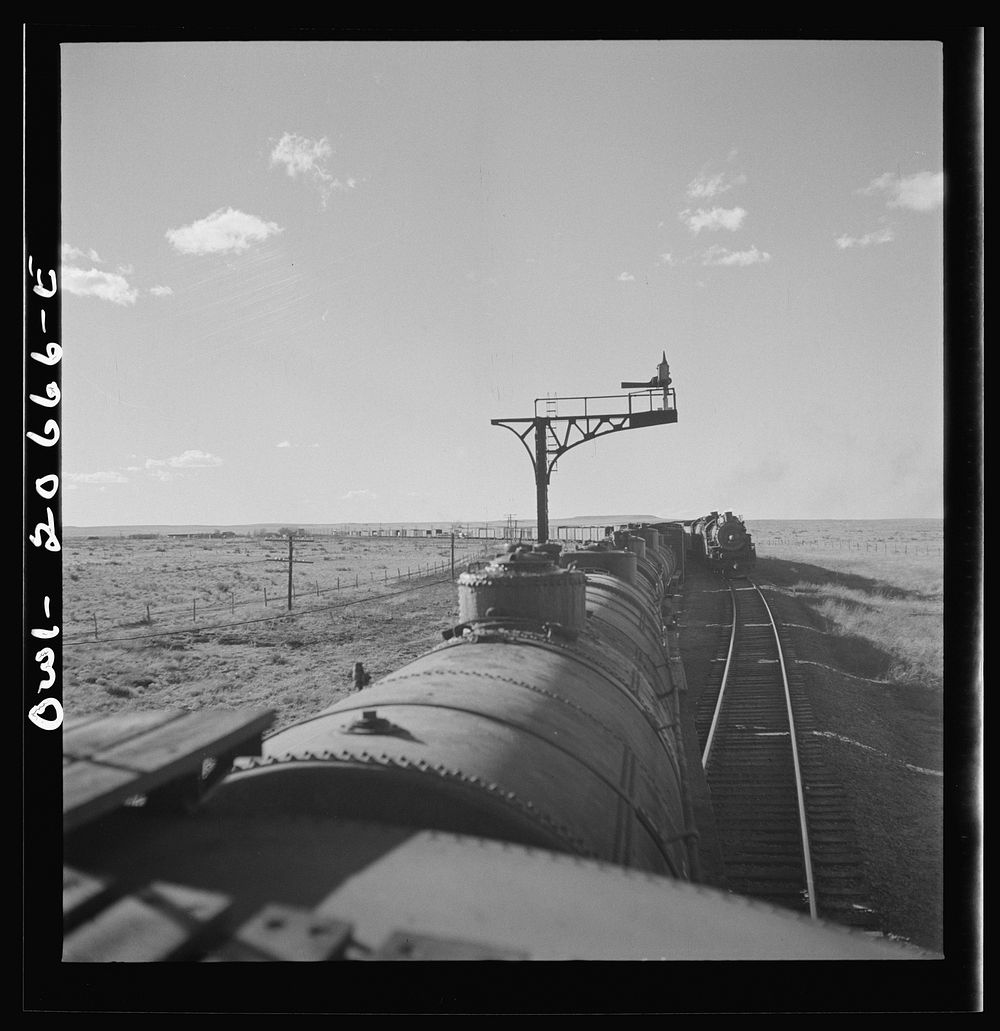 Buchanan, New Mexico. Passing an eastbound freight along the Atchison, Topeka, and Santa Fe Railroad between Clovis and…
