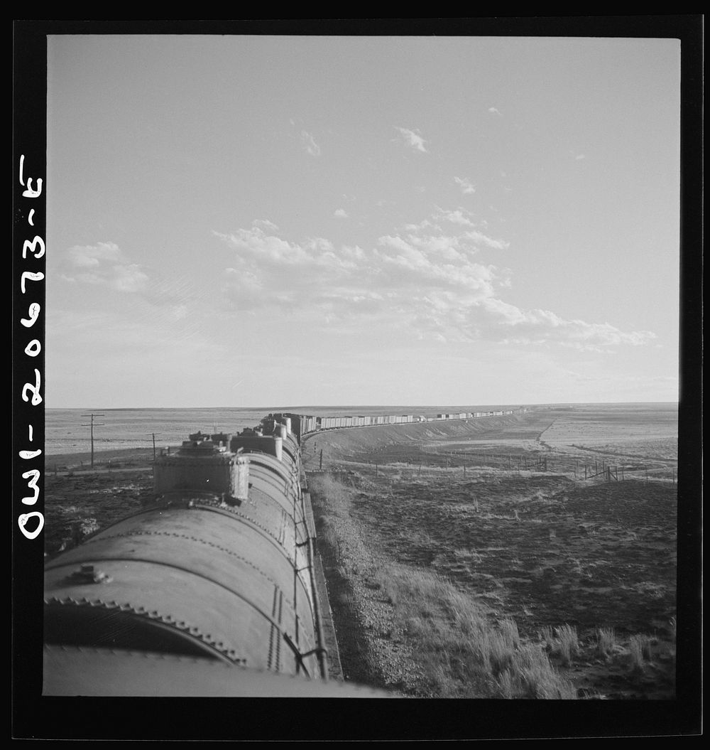 Duoro, New Mexico. Rounding a curve in the sheep and cattle country along the Atchison, Topeka, and Santa Fe Railroad…