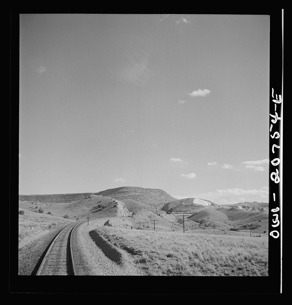 Coming out of the mountains on the Atchison, Topeka and Santa Fe Railroad between Vaughn and Belen, New Mexico into the Rio…