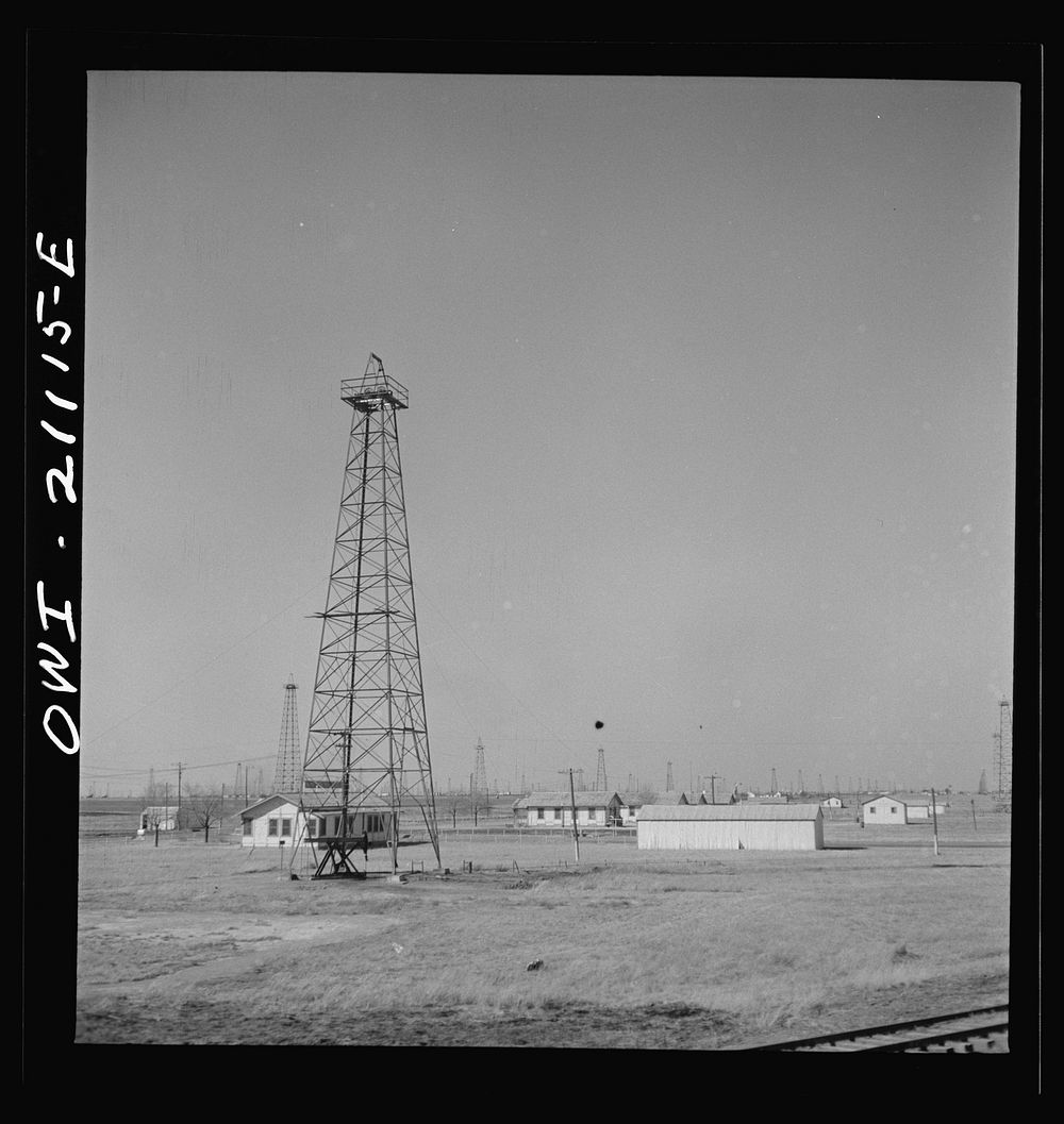 Pampa (vicinity), Texas. Passing an oil field along the Atchison, Topeka and Santa Fe Railroad between Canadian and…