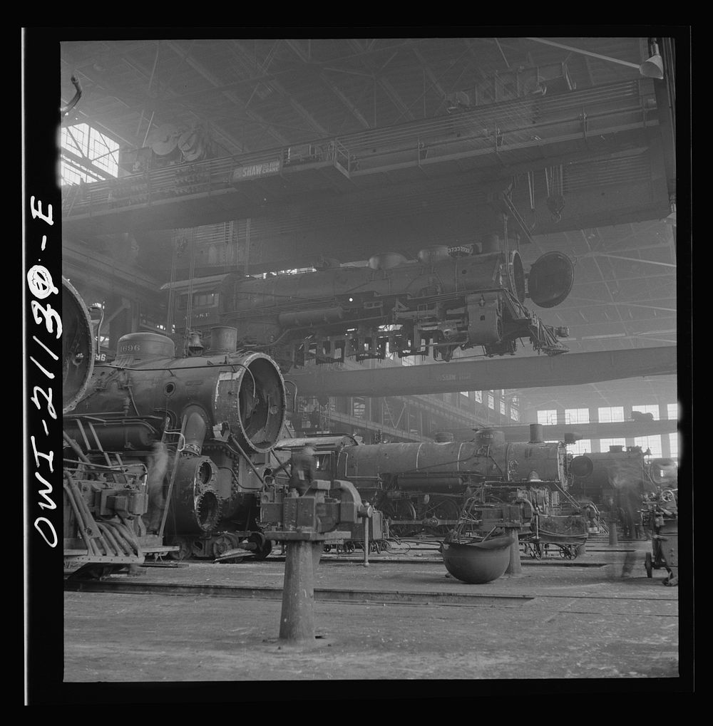 [Untitled photo, possibly related to: Albuquerque, New Mexico. An engine being carried to another part of the Atchison…