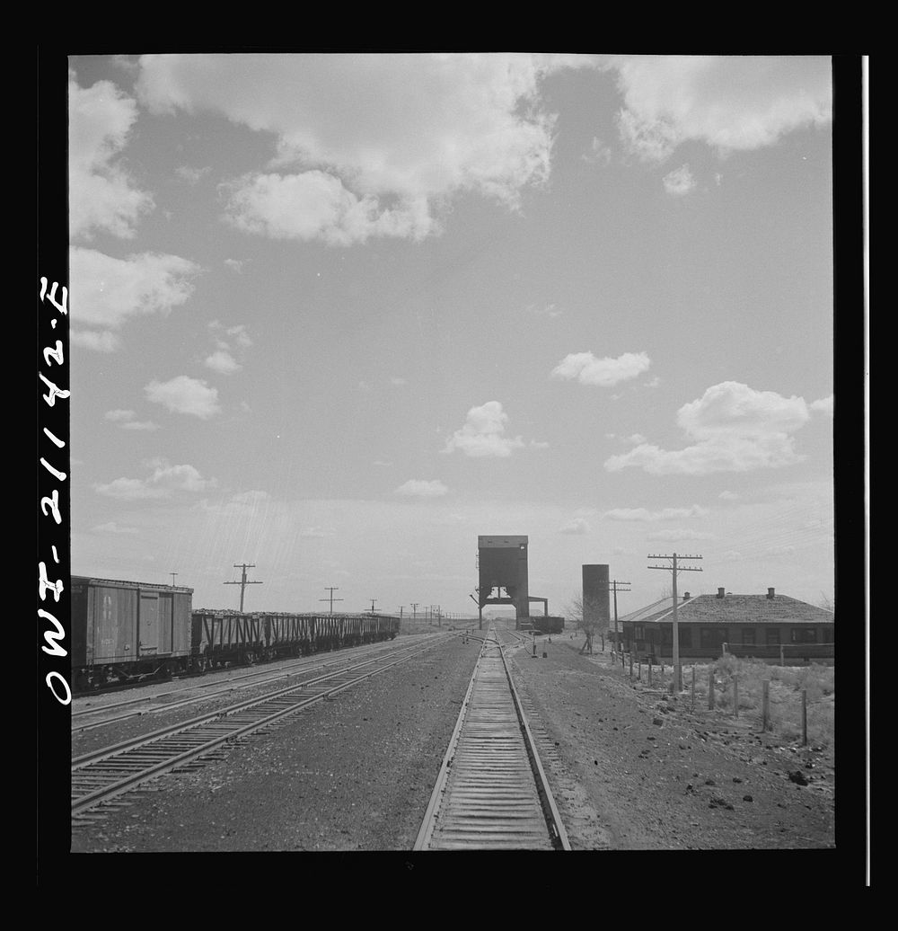 [Untitled photo, possibly related to: Quirk (vicinity), New Mexico. Going through the town along the Atchison, Topeka and…