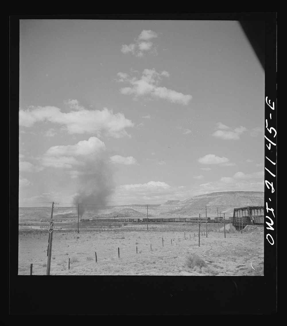 Laguna (vicinity), New Mexico. A train going around a curve along the Atchison, Topeka and Santa Fe Railroad between Belen…