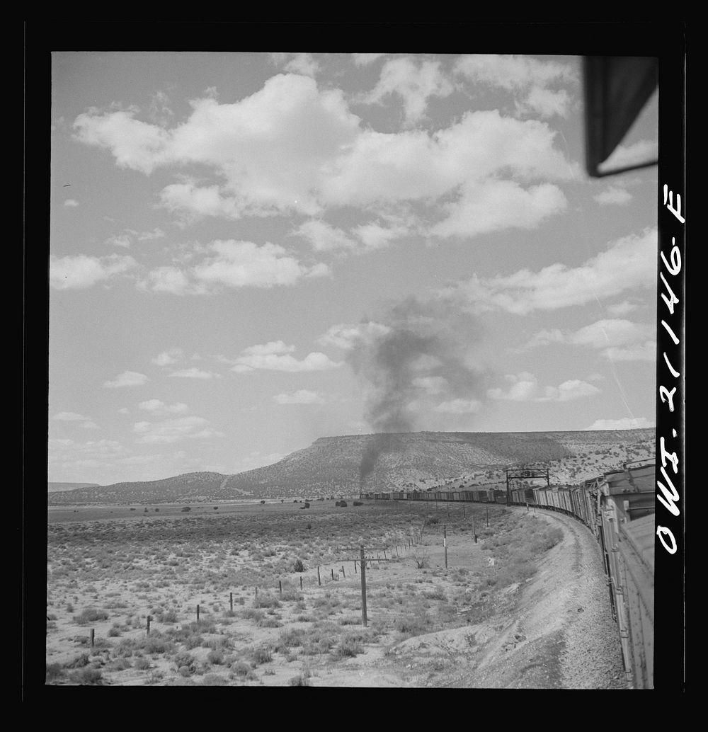 Laguna (vicinity), New Mexico. A train going around a curve along the Atchison, Topeka and Santa Fe Railroad between Belen…