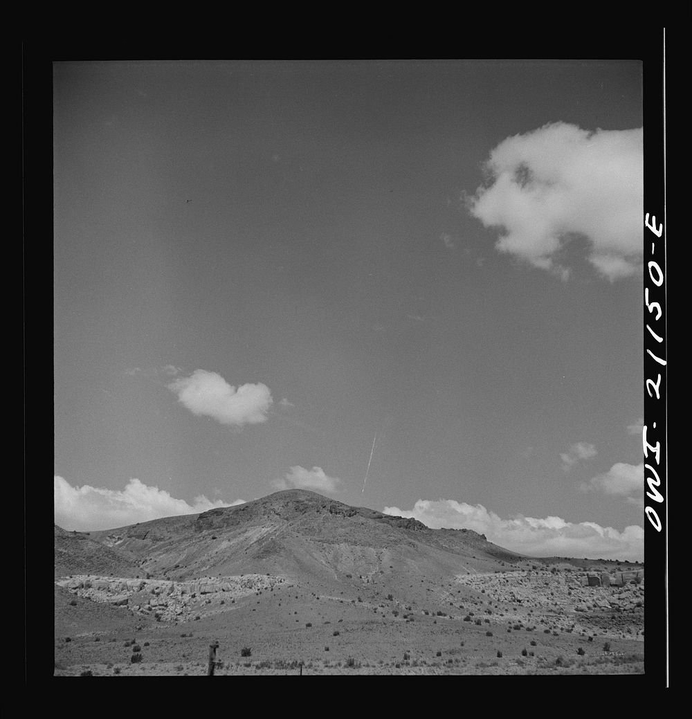 Laguna (vicinity), New Mexico. Hills studded with dwarf cedars along the Atchison, Topeka and Santa Fe Railroad between…