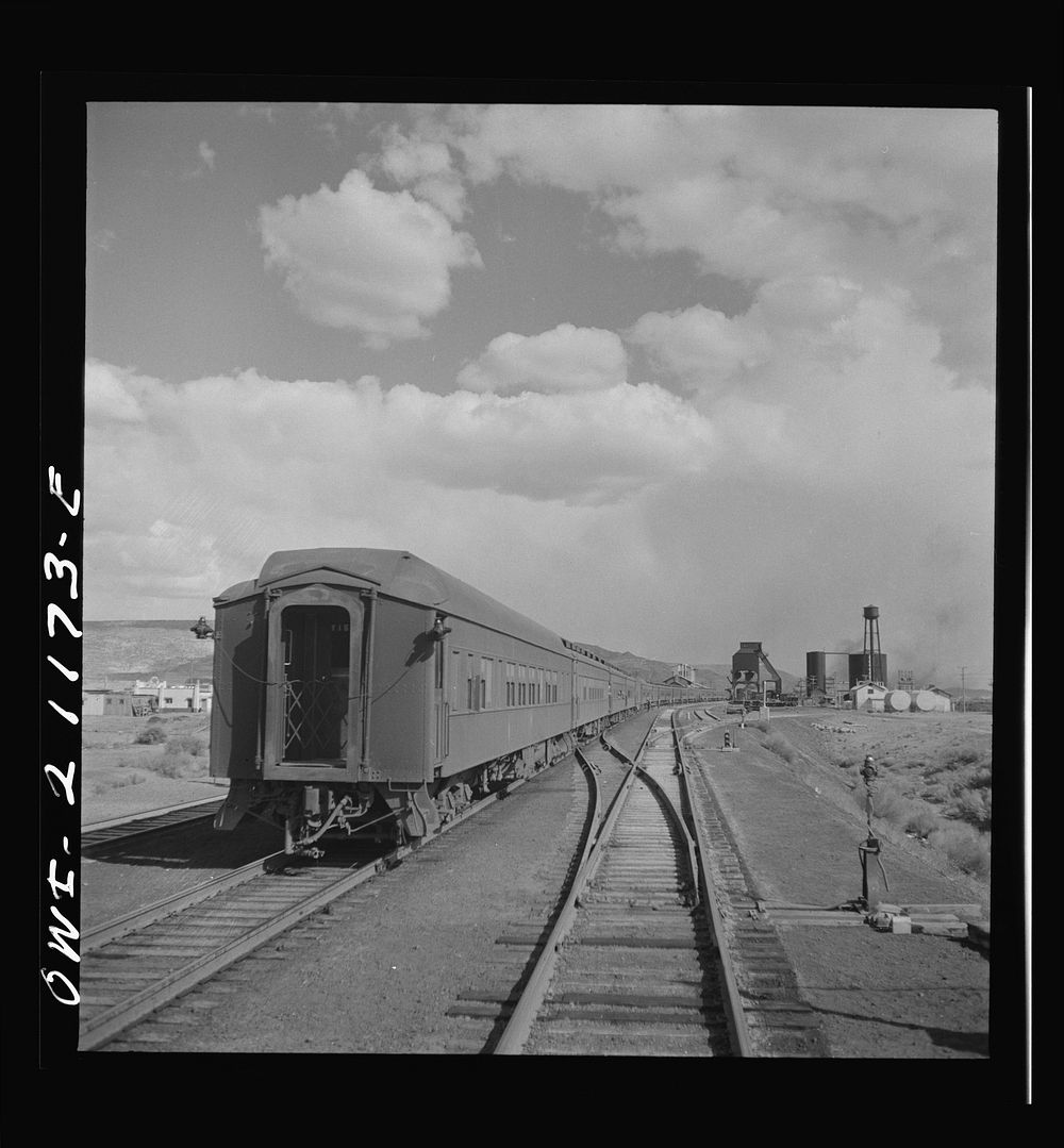 Grants, New Mexico. Passing a troop train stopping for coal and water on the Atchison, Topeka and Santa Fe Railroad between…