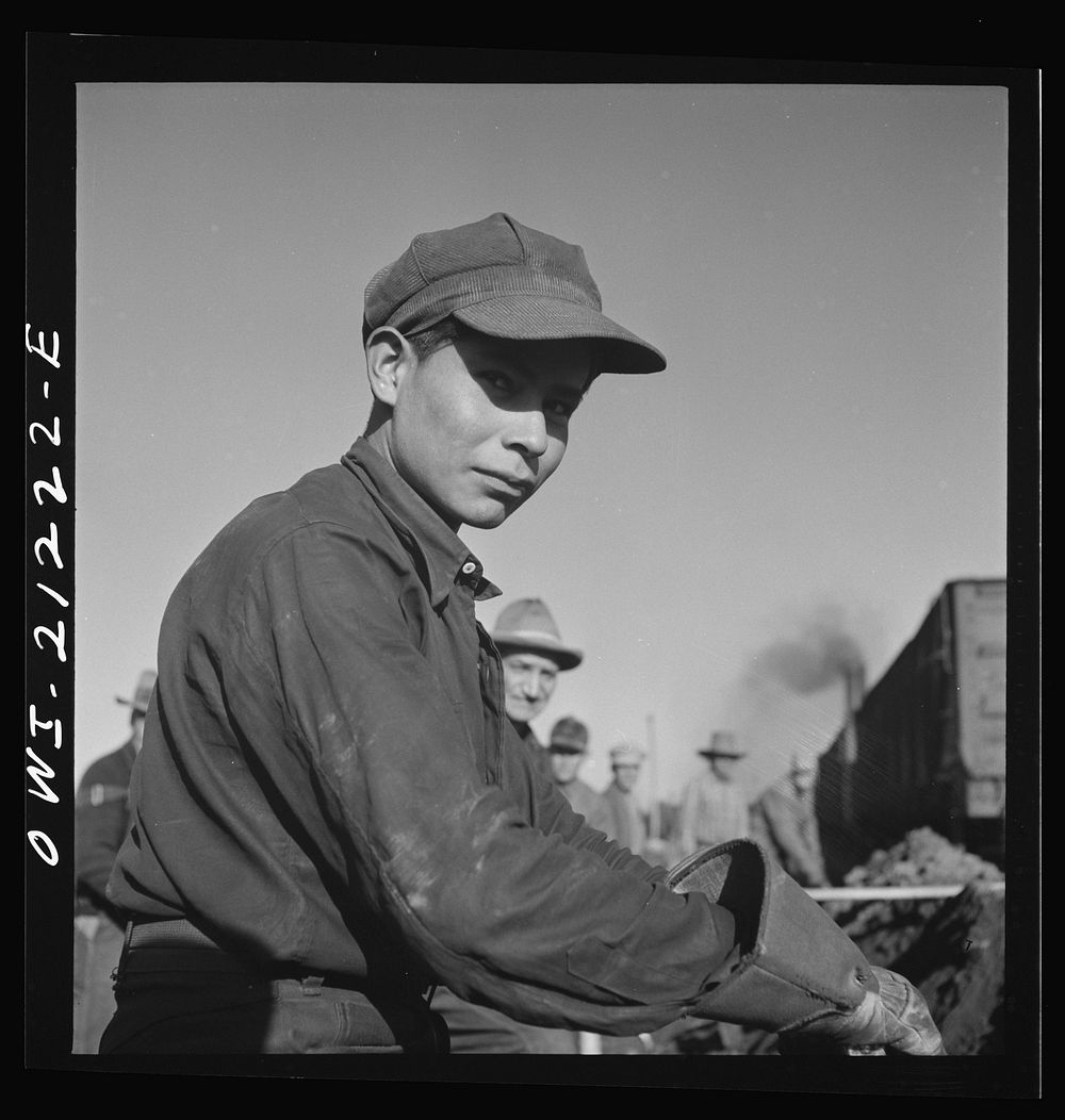 Winslow, Arizona. A young Indian laborer working in the Atchison, Topeka and Santa Fe Railroad yard. Sourced from the…