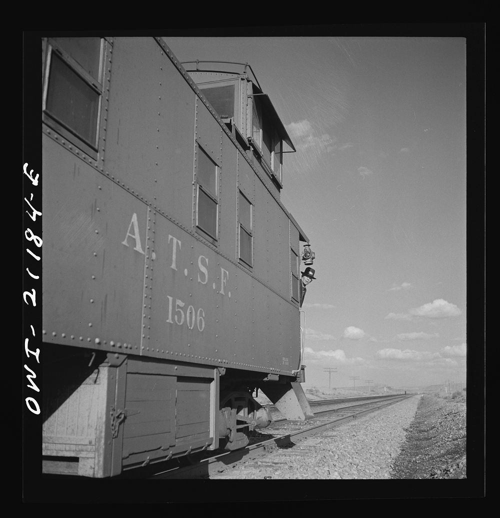 Thoreau, New Mexico. A train stopping at a siding along the Atchison, Topeka and Santa Fe Railroad between Belen and Gallup…