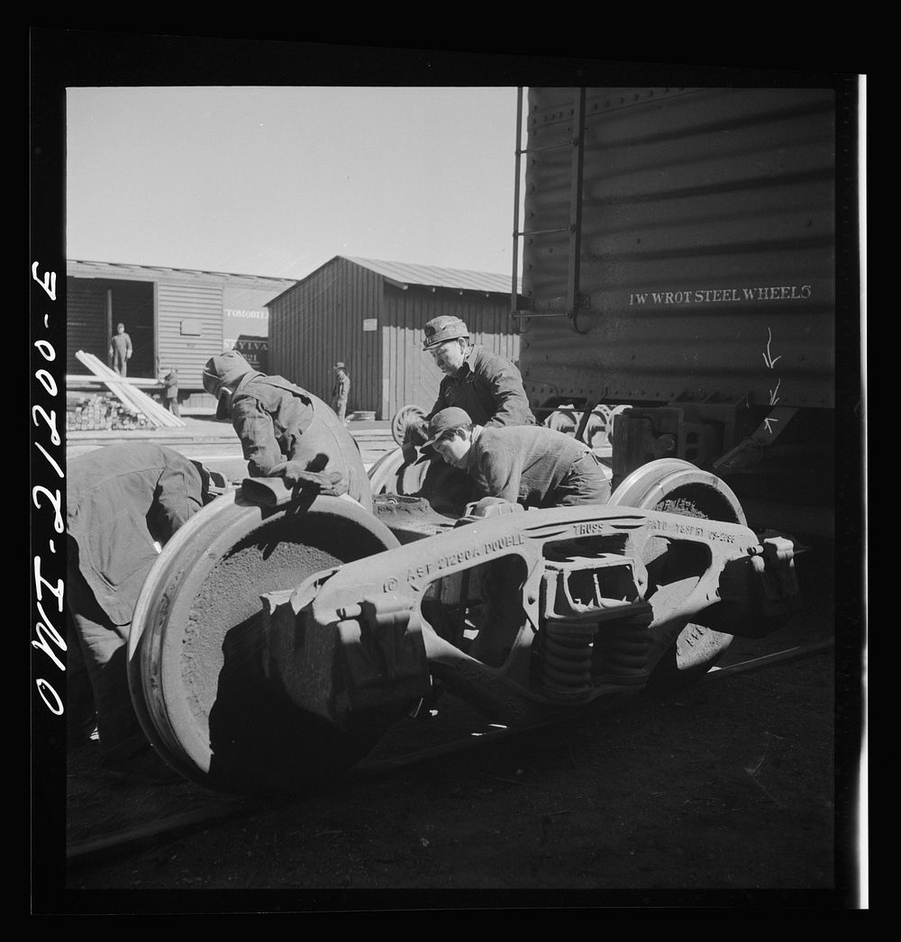 Gallup, New Mexico. Laguna Indians working in the Atchison, Topeka and Santa Fe Railroad shops. There are about twenty of…