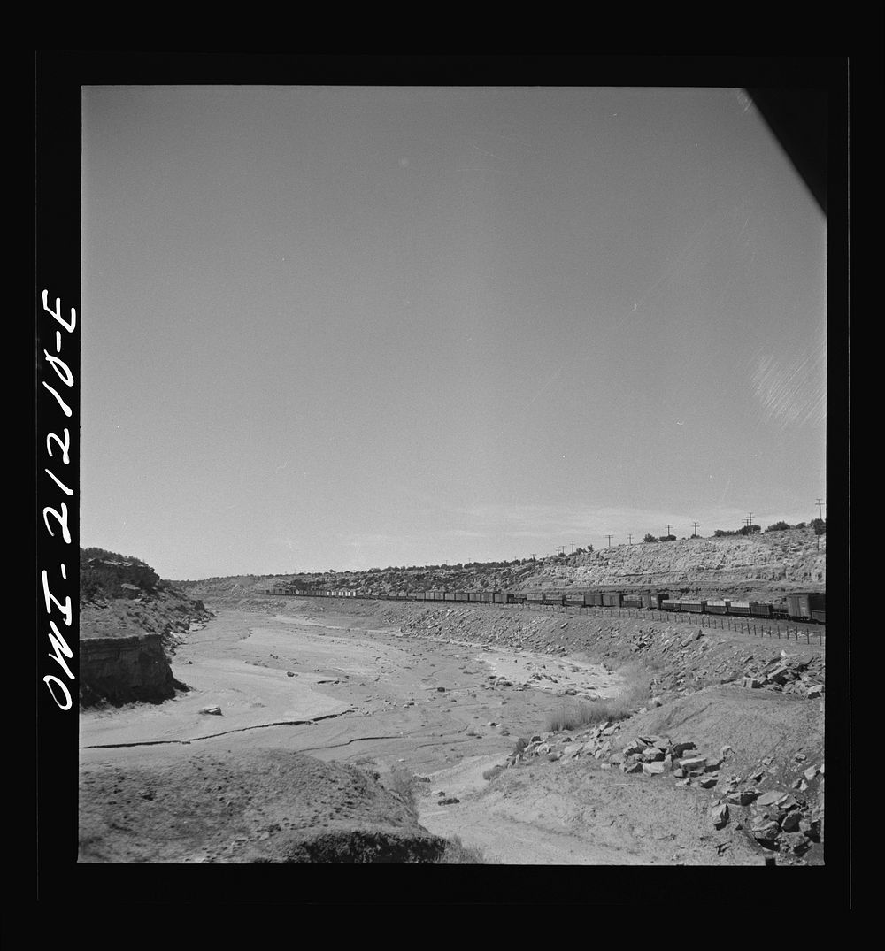 Houck (vicinity), Arizona. Passing a dry riverbed along the Atchison, Topeka and Santa Fe Railroad between Gallup, New…