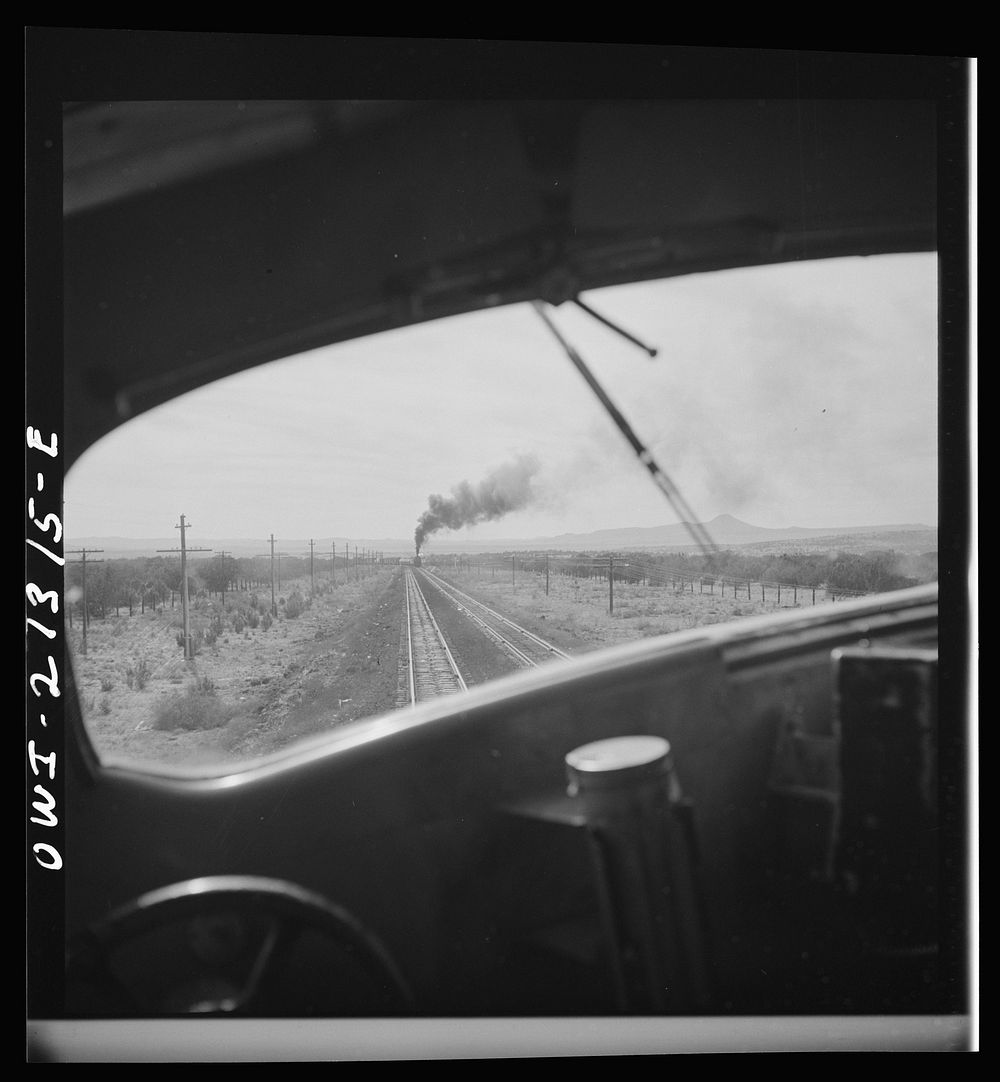 [Untitled photo, possibly related to: Ash Fork (vicinity), Arizona. Passing an eastbound freight train on the Atchison…