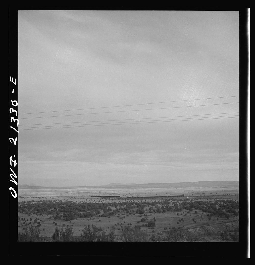 Gleed (vicinity), Arizona. East and westbound trains passing on the Atchison, Topeka and Santa Fe Railroad between Winslow…