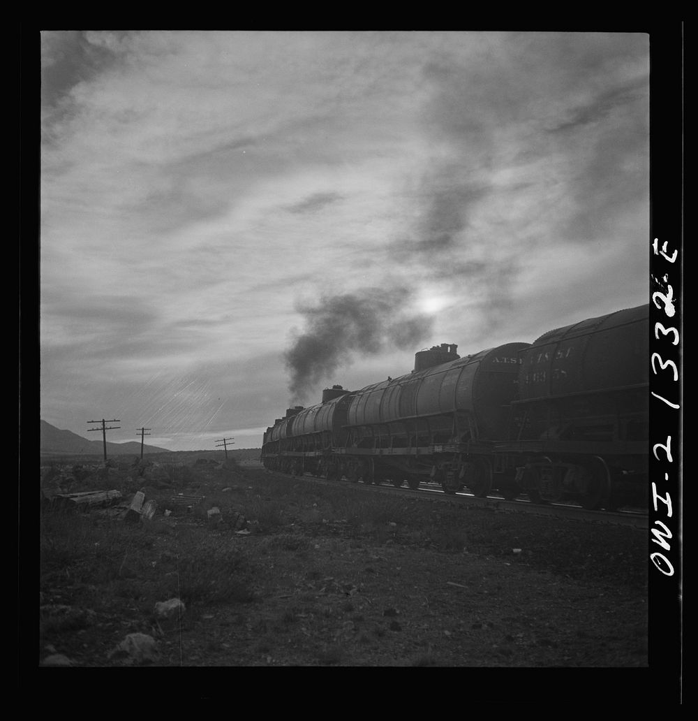 [Untitled photo, possibly related to: Gleed (vicinity), Arizona. A westbound local freight train passing on the Atchison…
