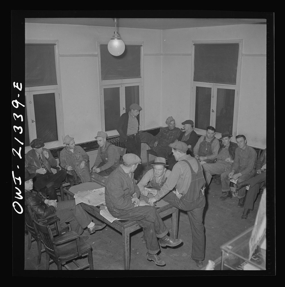 Seligman, Arizona. Railroad men lounging in the lobby of the Harvey House near the Atchison, Topeka, and Santa Fe Railroad…