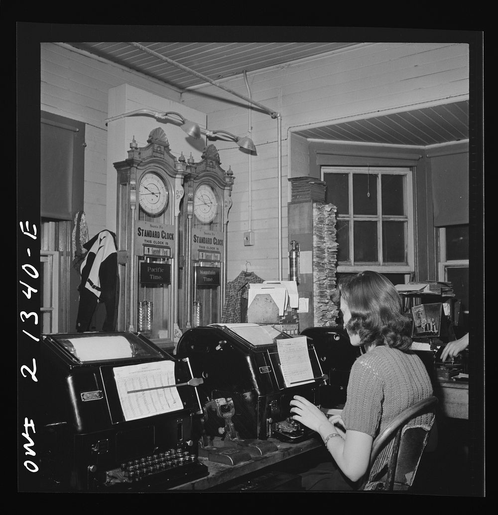 [Untitled photo, possibly related to: Seligman, Arizona. Teletype operator in the telegraph office of the Atchison, Topeka…