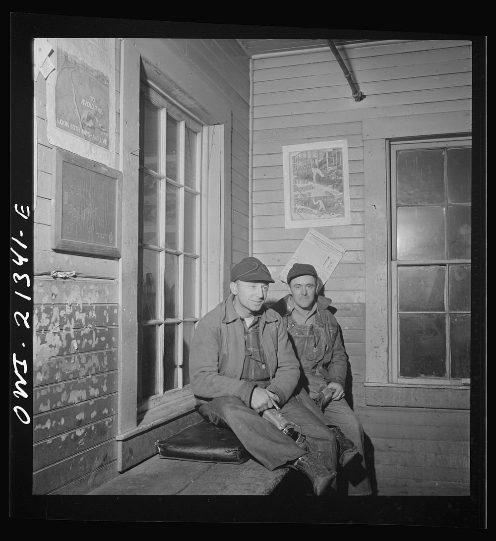 Selgiman, Arizona. Switchmen in their shanty ready to go to work in the Atchison, Topeka, and Santa Fe Railroad yard.…