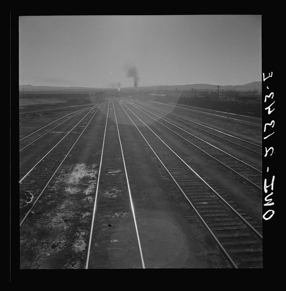 [Untitled photo, possibly related to: Seligman, Arizona. Leaving the Atchison, Topeka, and Santa Fe Railroad yard between…