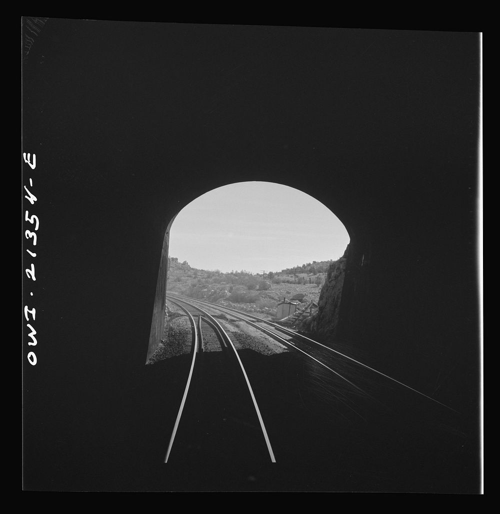 Yampai (vicinity), Arizona. Going through a small tunnel on the Atchison, Topeka, and Santa Fe Railroad between Seligman…
