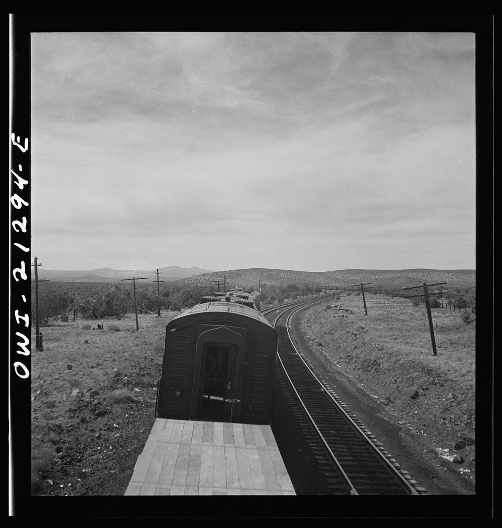 [Untitled photo, possibly related to: Diesel freight train on the Atchison, Topeka and Santa Fe Railroad between Winslow and…