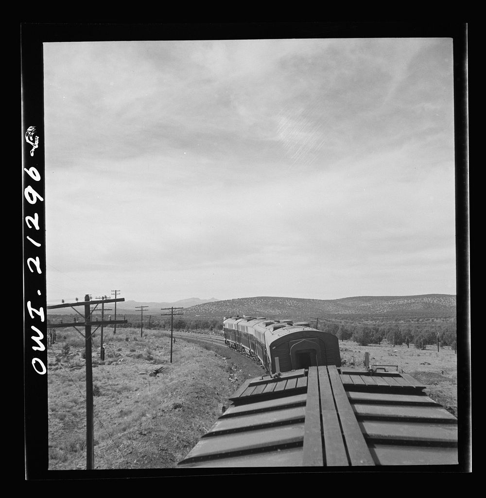 Diesel freight train on the Atchison, Topeka and Santa Fe Railroad between Winslow and Seligman, Arizona going down the…