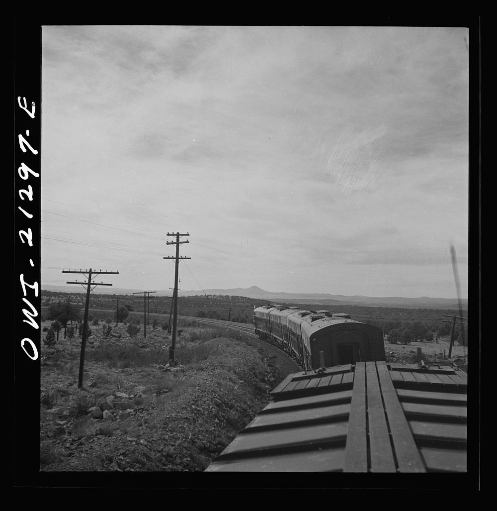[Untitled photo, possibly related to: Diesel freight train on the Atchison, Topeka and Santa Fe Railroad between Winslow and…