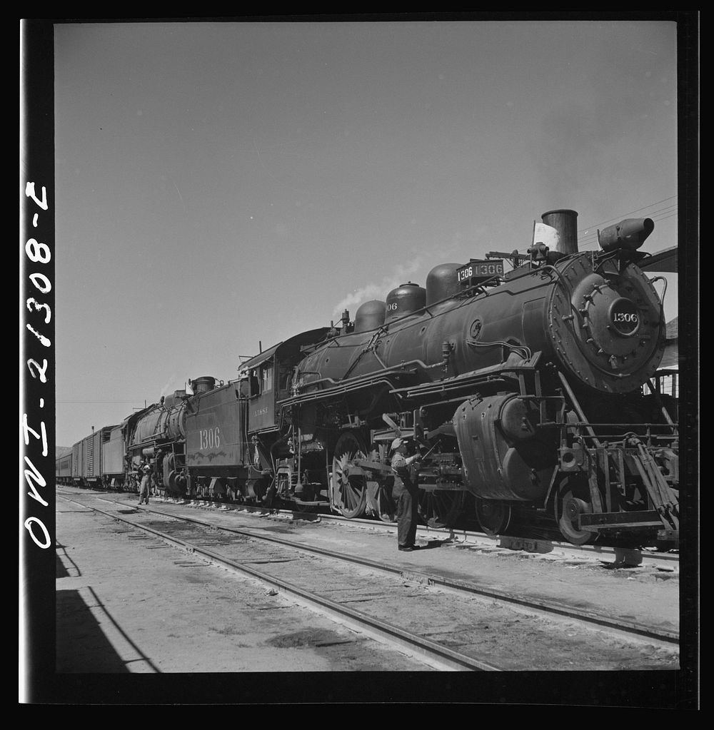 Kingman, Arizona. The engineer of an eastbound train on the Atchison, Topeka and Santa Fe Railroad between Seligman, Arizona…