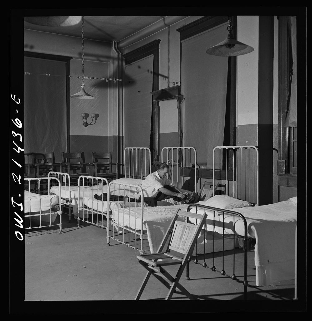 Barstow, California. Brakeman Thurston H. Lee, (whose home is in Chicago) going to bed at the reading room in Barstow…