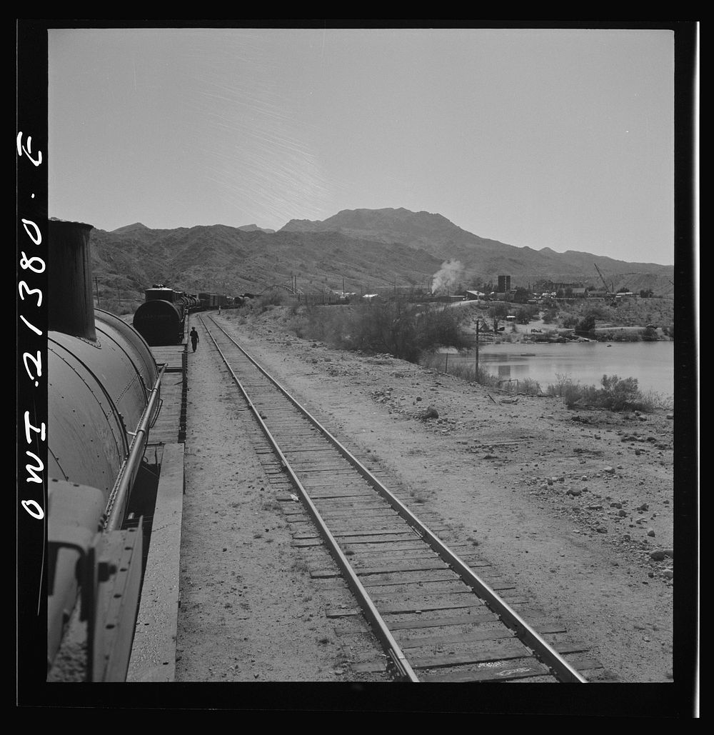 Topock, Arizona. A local freight train on the Atchison, Topeka and Santa Fe Railroad between Seligman, Arizona and Needles…