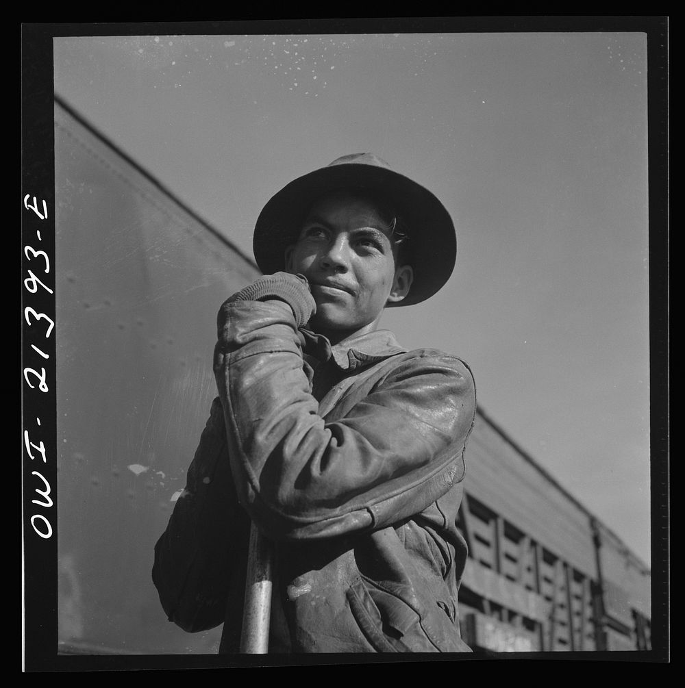 Needles, California. Young Indian worker employed on a section gang working on the tracks in the Atchison, Topeka and Santa…