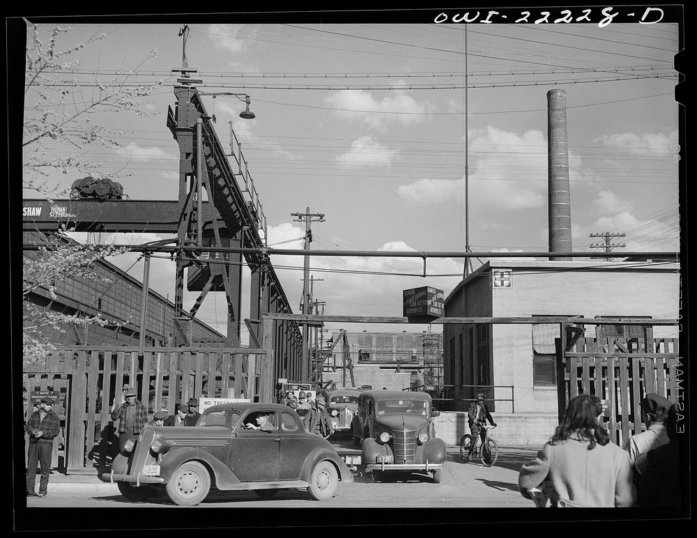 Albuquerque, New Mexico. Men coming out of the Atchison, Topeka, and Santa Fe Railroad shops at the end of the day's shift.…