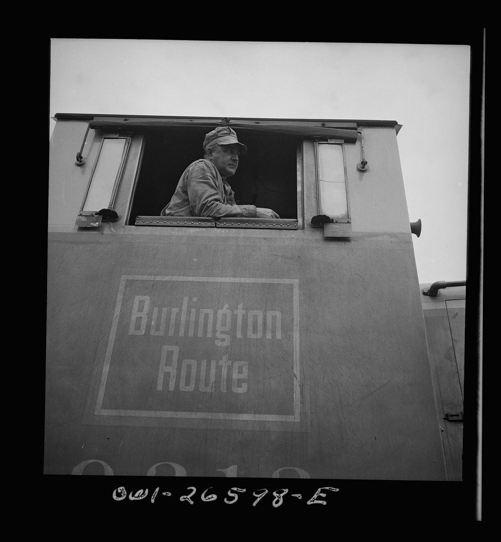Cicero, Illinois. Engineer in the cab of a diesel switch engine at the Clyde yard of the Chicago, Burlington and Quincy…