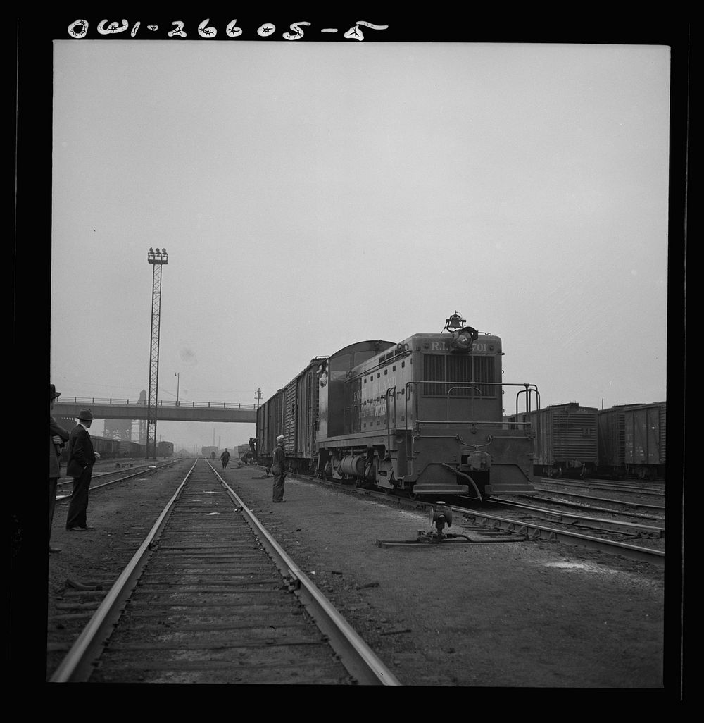 Switching a train with a diesel switch engine on the Chicago and Rock Island Railroad. Sourced from the Library of Congress.