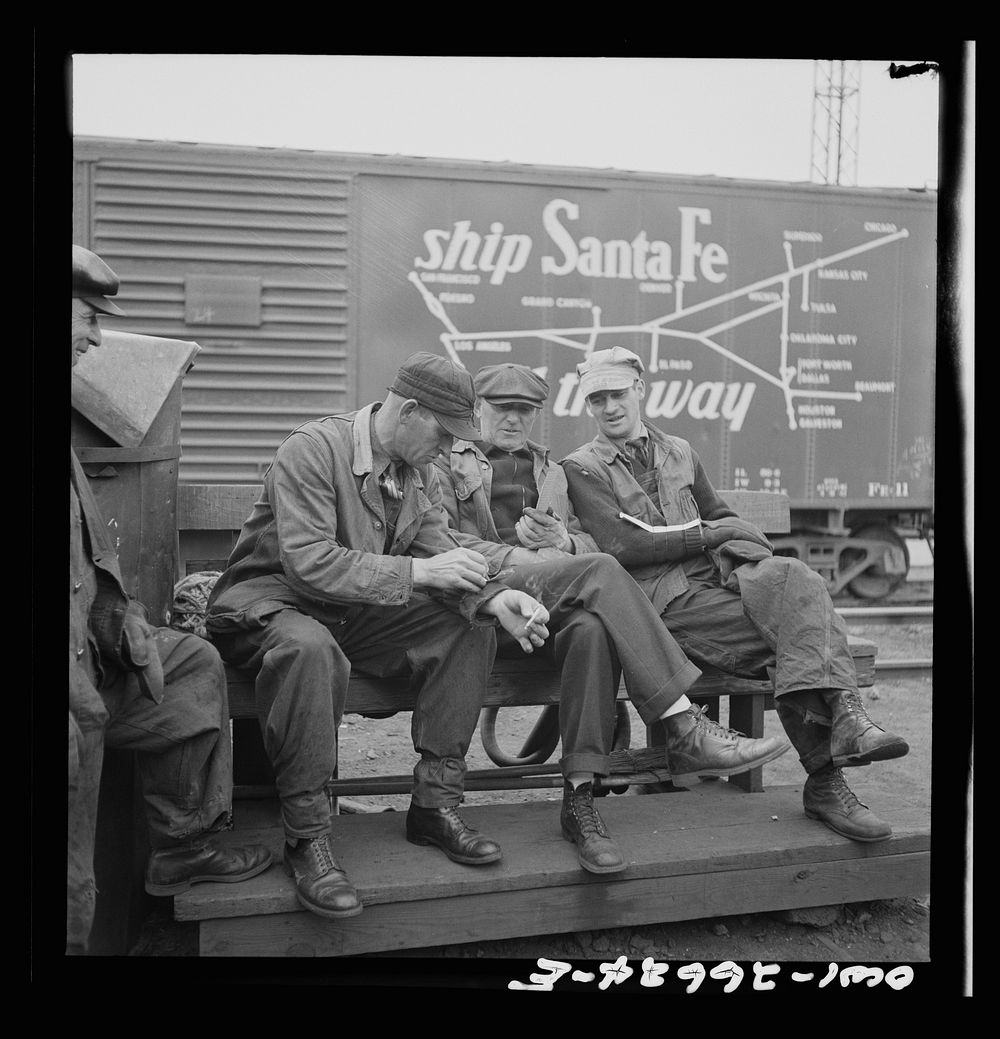 Cicero, Illinois. Switchmen discussing their switch lists at the Clyde yard of the Chicago, Burlington and Quincy Railroad.…